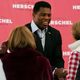 Herschel Walker, Republican candidate for U.S. Senate in Georgia, greets supporters during a campaign rally Tuesday, Oct. 18, 2022, in Atlanta. (AP Photo/John Bazemore)